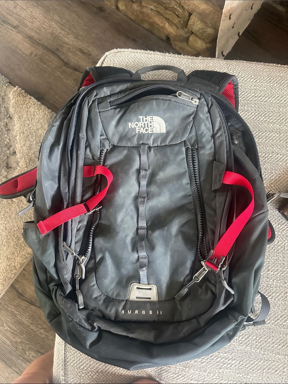 The North Face Surge II Black Backpack with Red Straps